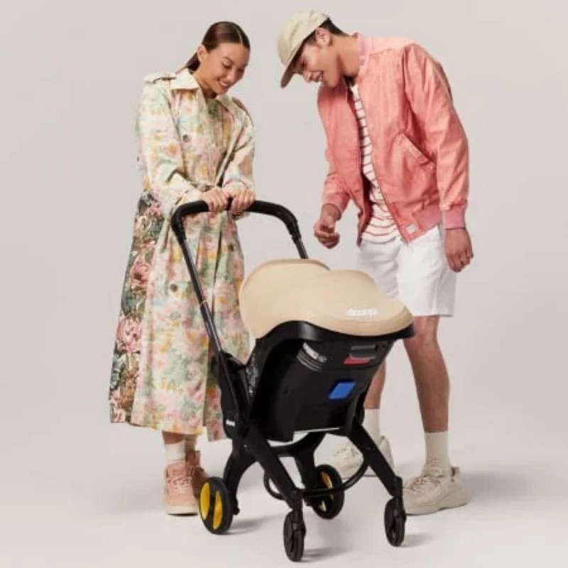 DOONA™ i-size Седалка с шаси 2 в 1, Sahara Sand