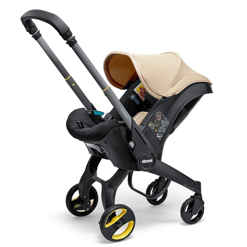 DOONA™ i-size Седалка с шаси 2 в 1, Sahara Sand